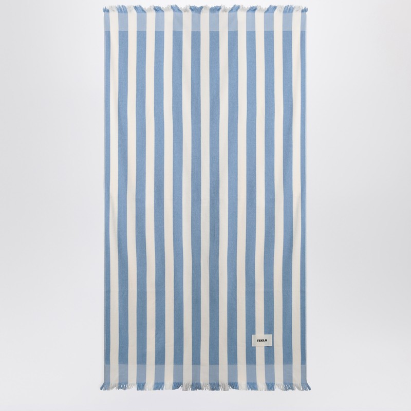 White and blue striped beach towel